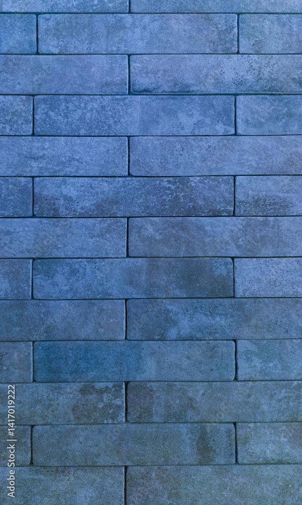 Naklejka premium The brick wall is blue. Brick blue background. The texture of the blue brick. Vertical image.