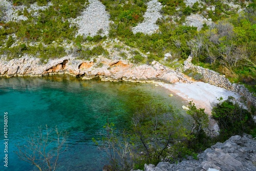 Fototapeta Naklejka Na Ścianę i Meble -  Beautiful beach at a cove at the coast of the Adriatic sea in Croatia