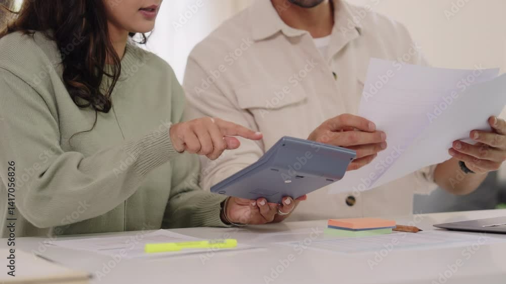 Couple budgeting and calculating tax with laptop at home, managing finance and planning for longterm investment Couple budgeting and calculating tax with laptop at home, managing finance and planning for longterm investment