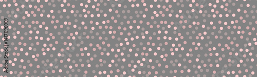 Elegant grayscale polka dot pattern.  Subtle pink accents on a dark grey background create a sophisticated yet playful design, perfect for websites, branding, or textile prints.