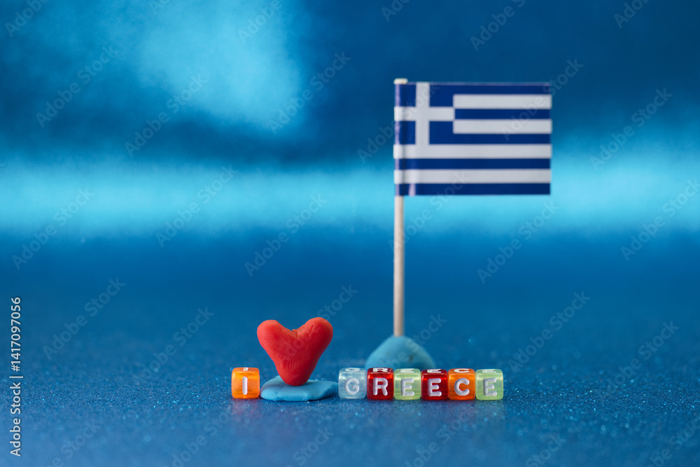 Heart and flag display expressing love for Greece on a bright blue background
