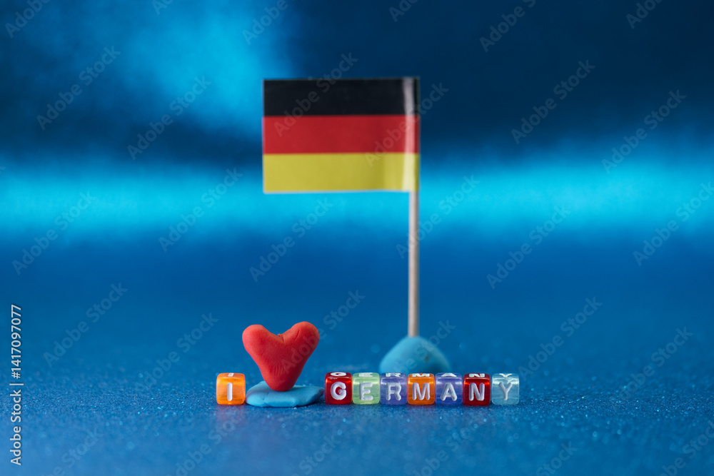 Colorful display of love for Germany featuring a flag and playful decorations on a vibrant background