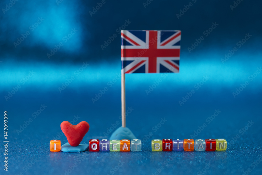 Creative display of love for Great Britain using colorful letters and a flag on a bright blue background