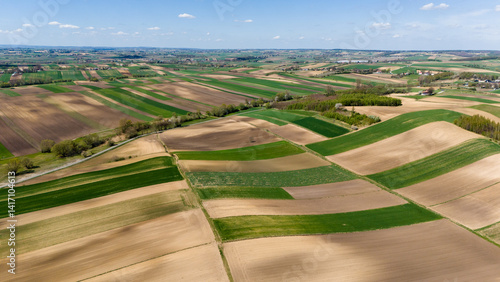 Obraz na płótnie drone view over countryside patchwork fields w salonie