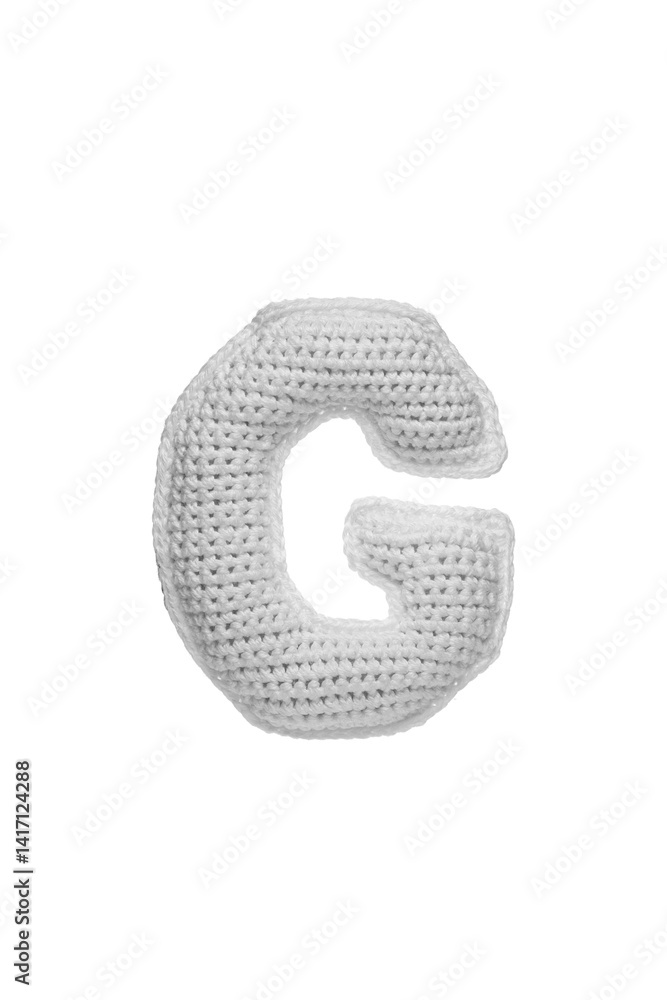 Handmade crocheted letter G in light grey yarn, isolated on white background Handmade crocheted letter G in light grey yarn, isolated on white background