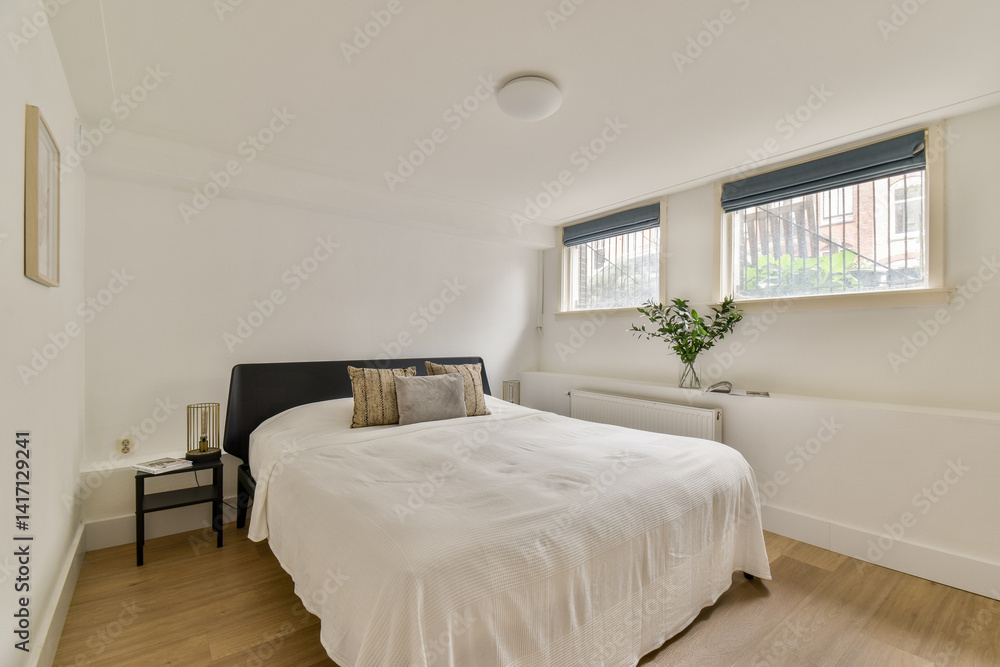 A serene and simple bedroom showcasing a comfortable bed, stylish decor, and natural light filtering through the windows. A serene and simple bedroom showcasing a comfortable bed, stylish decor, and natural light filtering through the windows.