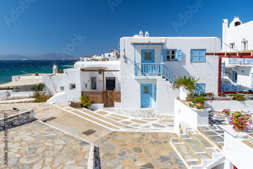 Fototapeta Naklejka Na Ścianę i Meble -  Streets and traditional architecture with blue-white buildings, island of Mykonos, Greece.