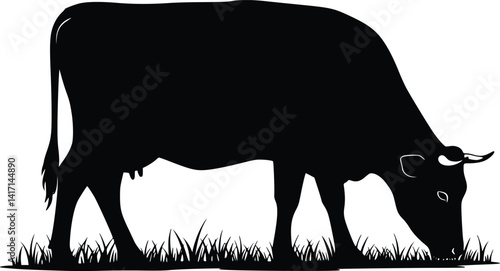 Silhouette of a grazing cow with lowered head feeding on grass, showcasing a peaceful farm life in minimalist design