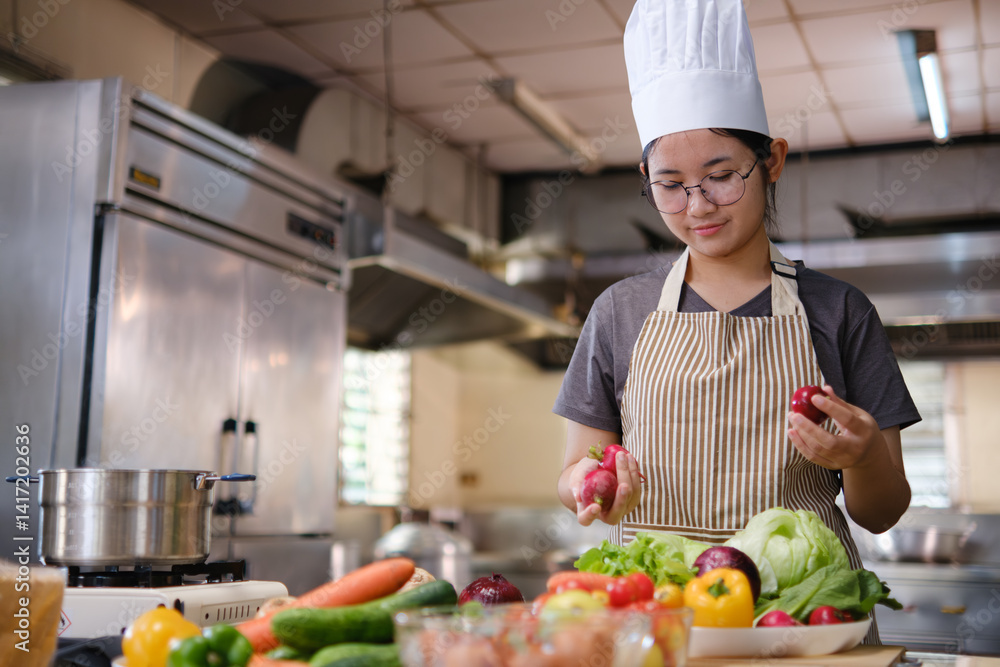 Culinary student standing confidently in training kitchen with fresh ingredients ready for cooking practice Culinary student standing confidently in training kitchen with fresh ingredients ready for cooking practice