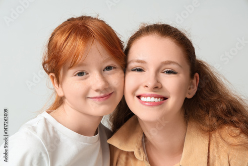 Young ginger woman and her ...