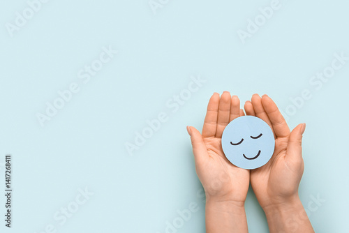 Obraz na płótnie Female hands with paper smile on green background. World Health Day w salonie