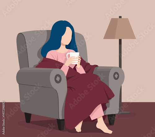 Woman in armchair with mug, blanket, and blue hair
