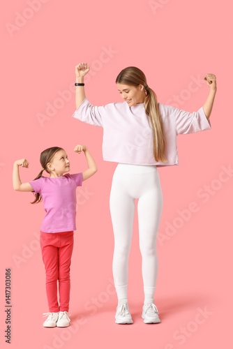 Sporty young mother and her...