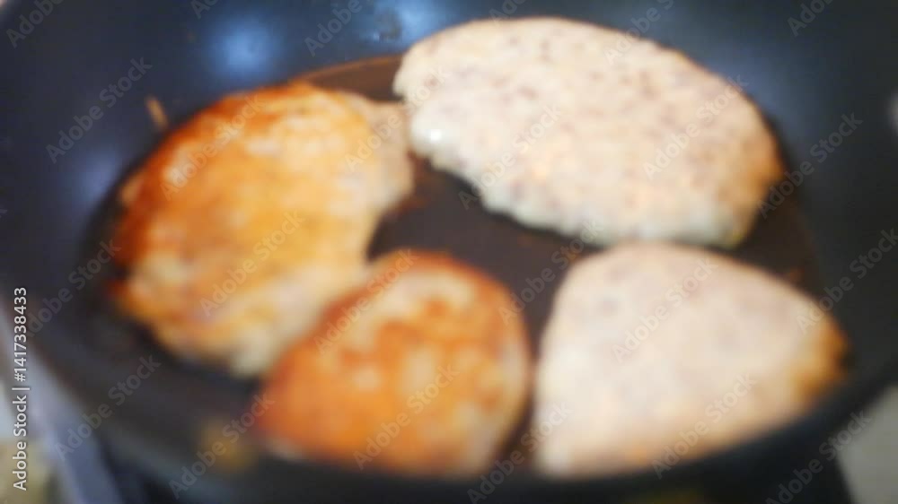 pancakes in a pan. Frying Pan On The Stove. Pancake Burned On The Pan. Mans Hand Turns The Pancake To The Other Side. He Lingers When He Sees That The Pancake Has Burned. pancakes in a pan. Frying Pan On The Stove. Pancake Burned On The Pan. Mans Hand Turns The Pancake To The Other Side. He Lingers When He Sees That The Pancake Has Burned.