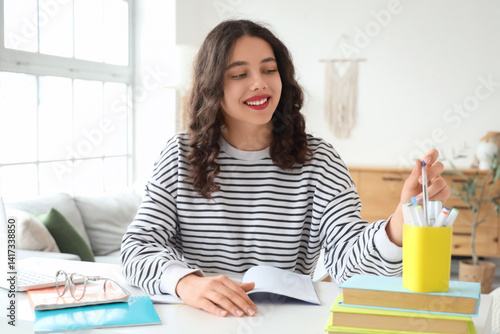 Obraz na płótnie Female Indian student studying at home w salonie