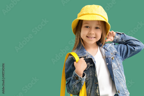 Cute little girl in bucket ...