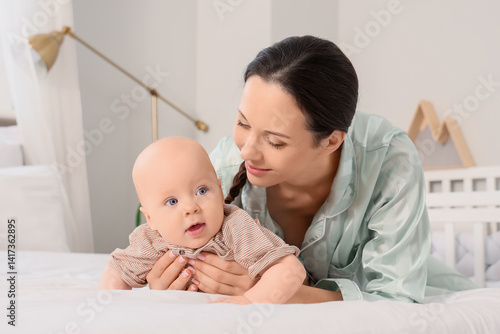 Happy mother with her littl...