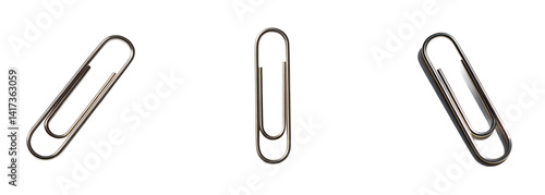 Three shiny metallic paper clips arranged on a bright white surface