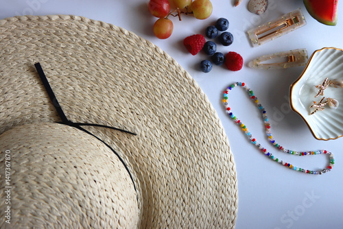Obraz na płótnie Straw hat, sunglasses, seasonal fruit, seashells and colorful accessories on white backgrounds. Cute summer essentials. Flat lay. w salonie