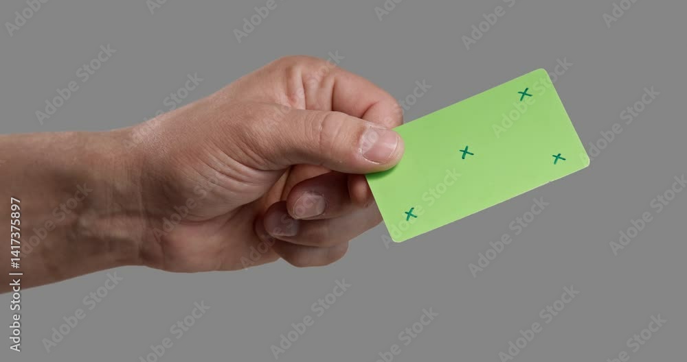Man's hand holding a credit card template that is perfect for layouts, digital payments, and finance-related projects. Without a corporate identity, it is perfect for creating customizable designs. Th Man's hand holding a credit card template that is perfect for layouts, digital payments, and finance-related projects. Without a corporate identity, it is perfect for creating customizable designs. Th