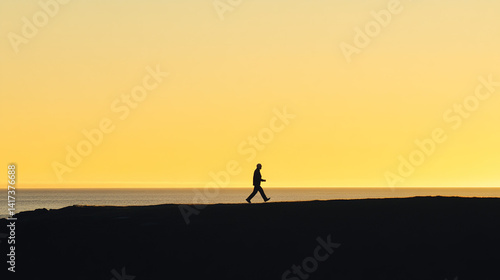 Elderly runner silhouetted against sunrise, motion trail effect; celebrating active aging and vitality