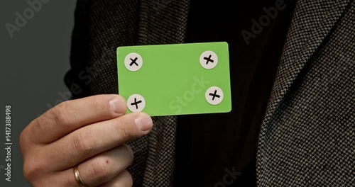 Man in the jacket holds a credit card template, which is ideal for creating layouts, digital payments, and finance-related projects. Without a corporate identity, it is perfect for creating customizab