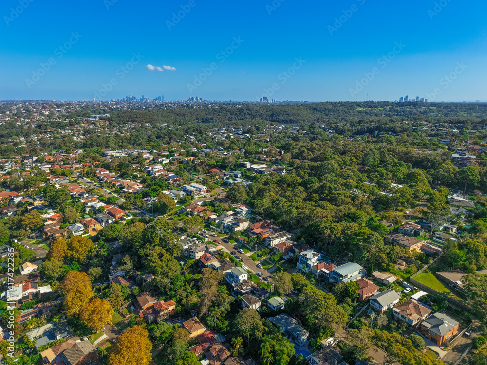 Panoramic drone aerial photo of residential area in Northern Beaches and Sydney Central Business District CBD in the distance