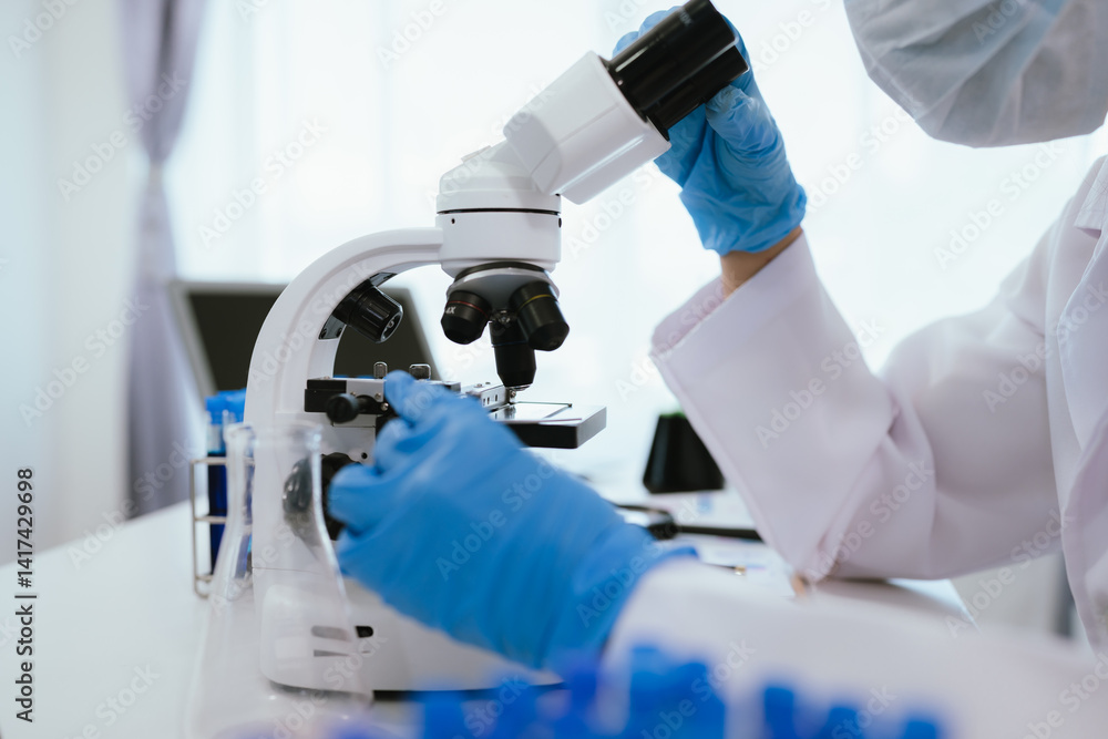 Scientist analyzes biological samples using advanced laboratory equipment for medical research, diagnosis, biotechnology development, and pharmaceutical or clinical discoveries. Scientist analyzes biological samples using advanced laboratory equipment for medical research, diagnosis, biotechnology development, and pharmaceutical or clinical discoveries.