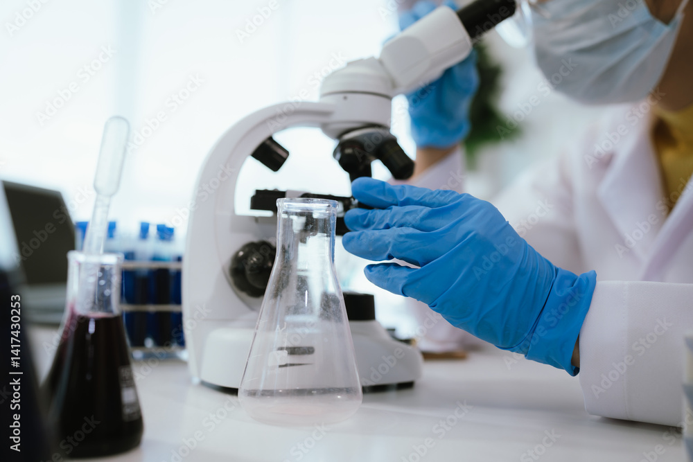 Scientist analyzes biological samples using advanced laboratory equipment for medical research, diagnosis, biotechnology development, and pharmaceutical or clinical discoveries.