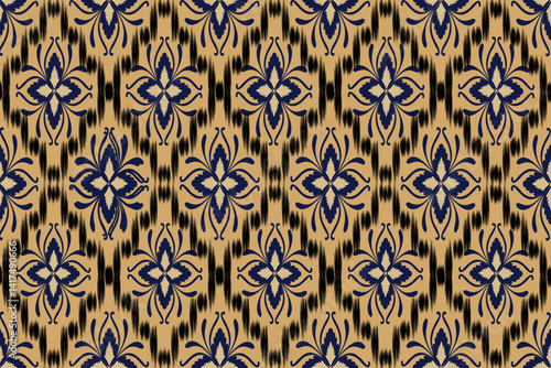 The seamless fabric pattern imitates brown and black ikat silk, which is an applied pattern.