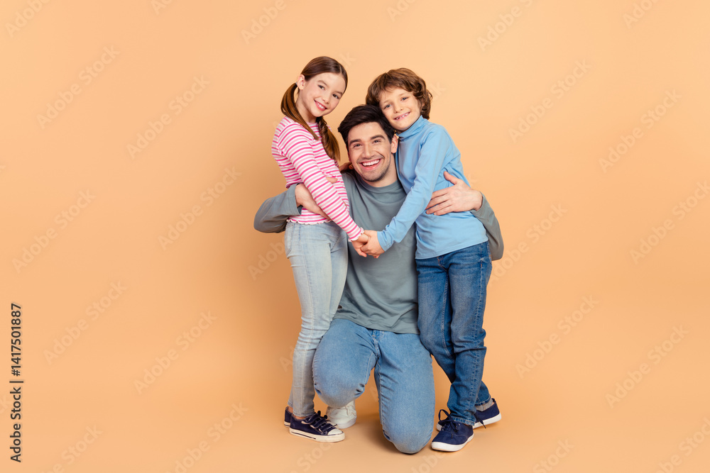 Happy family of three posing together, featuring a father with his son and daughter, expressing love and bonding Happy family of three posing together, featuring a father with his son and daughter, expressing love and bonding