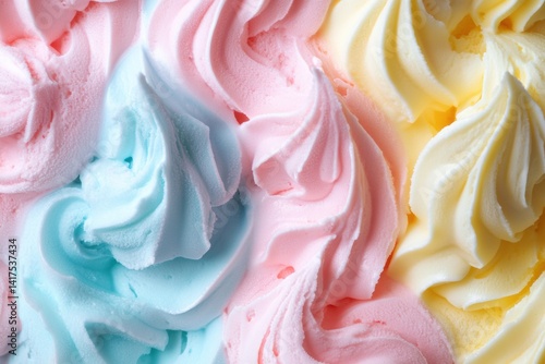 Colorful swirls of whipped ice cream in blue, pink, and yellow
