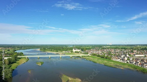 The Loire River winds through the countryside of Sully-sur-Loire in Europe, France, in the Centre region, in Loiret, in summer, on a sunny day. 