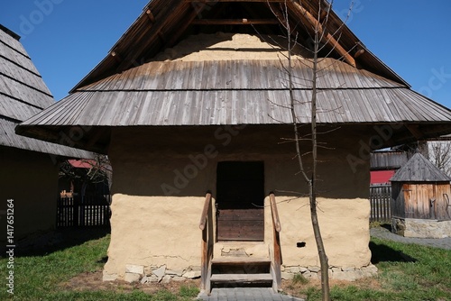 Obraz na płótnie Hiscoric buildings named sypaniec in Kacwin, Poland. These are original Spis granaries - wooden grain warehouses, stone foundation covered with clay with movable sloping roof. w salonie