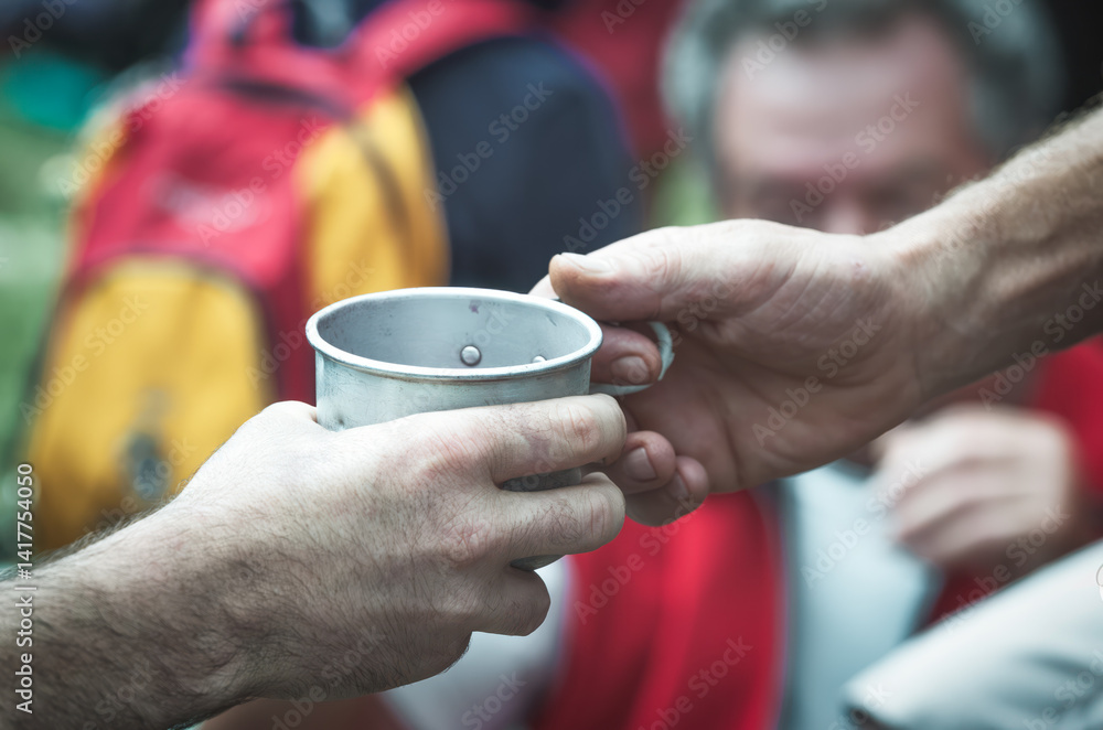 Exchange of tin glass in the hands Exchange of tin glass in the hands