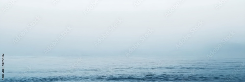 A foggy day with a calm ocean