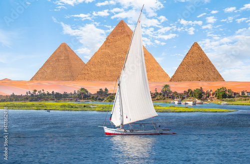 Obraz na płótnie Beautiful Nile scenery with traditional Felluca sailing boat in the Nile on the way to Giza pyramids - Cairo, Egypt w salonie