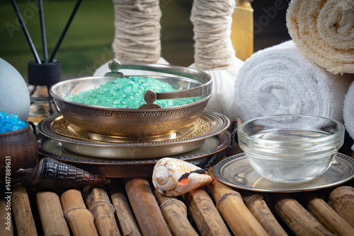 Spa massage items are arranged in a composition on the table.