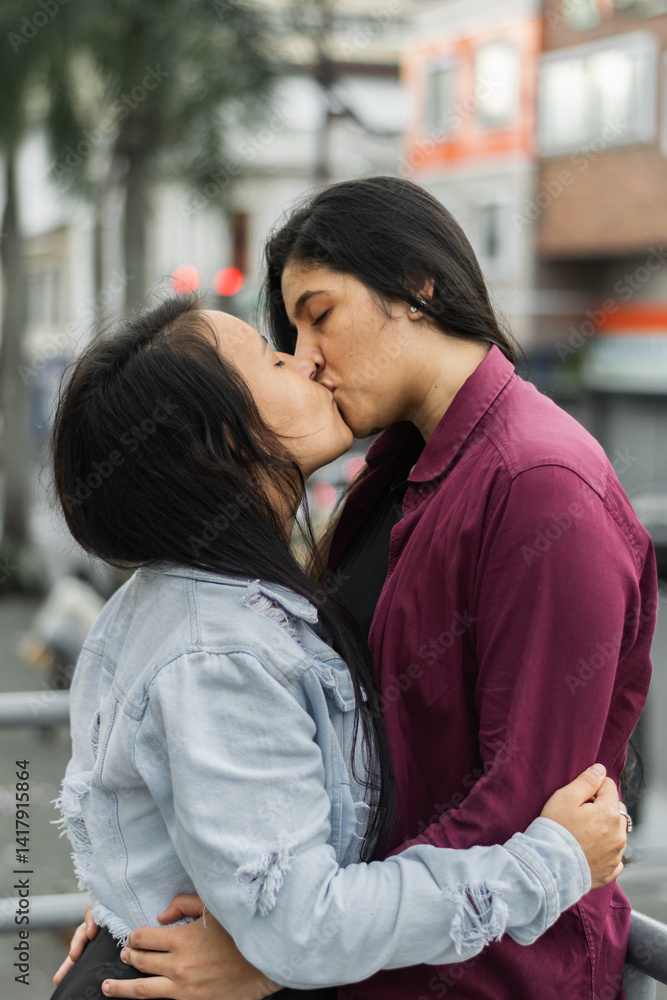 close-up of a couple of latin lesbian women kissing on the streets of a south american city, colombian women close-up of a couple of latin lesbian women kissing on the streets of a south american city, colombian women