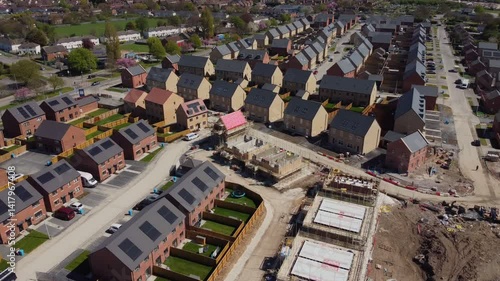 Drone 50fps. Housing development, construction site, new modern family houses. Filmed Hull. UK
