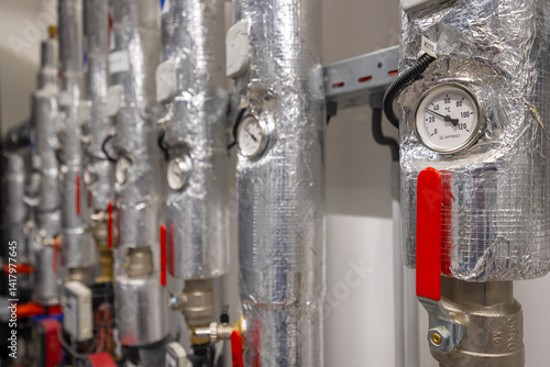 Obraz na płótnie Heating system pipes and valves regulating temperature with thermal insulation and thermometer showing degrees celsius w salonie