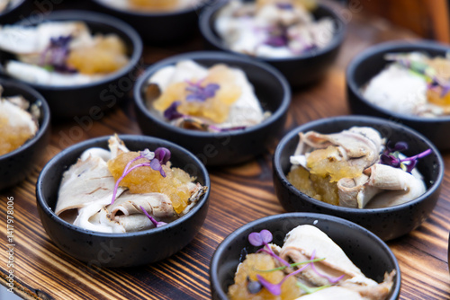 Obraz na płótnie Catering company preparing delicious canapes with meat, sauce and microgreens w salonie