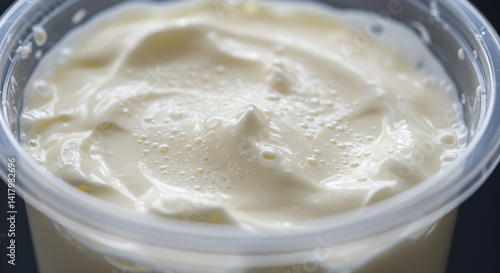 Thick And Creamy Greek Yogurt In Transparent Container, Isolated Close-Up Shot