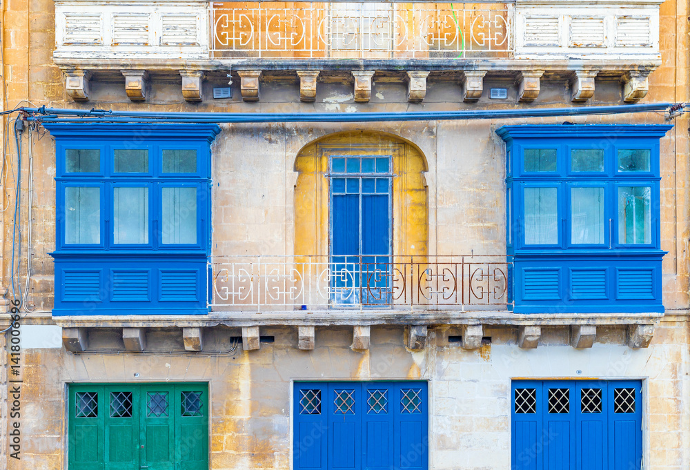 Facade of a residential building with traditional Maltese balconies, Valletta, Malta