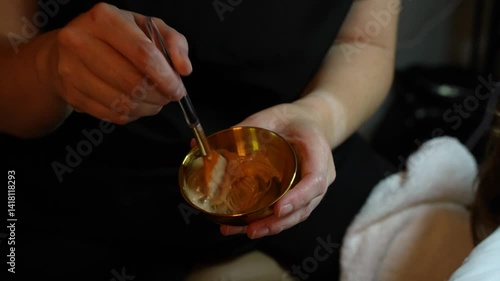 Woman getting facial at spa