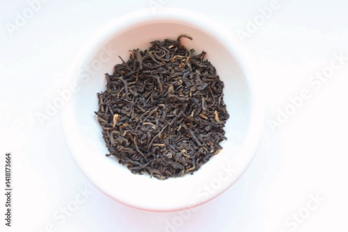 black tea leaves on white background