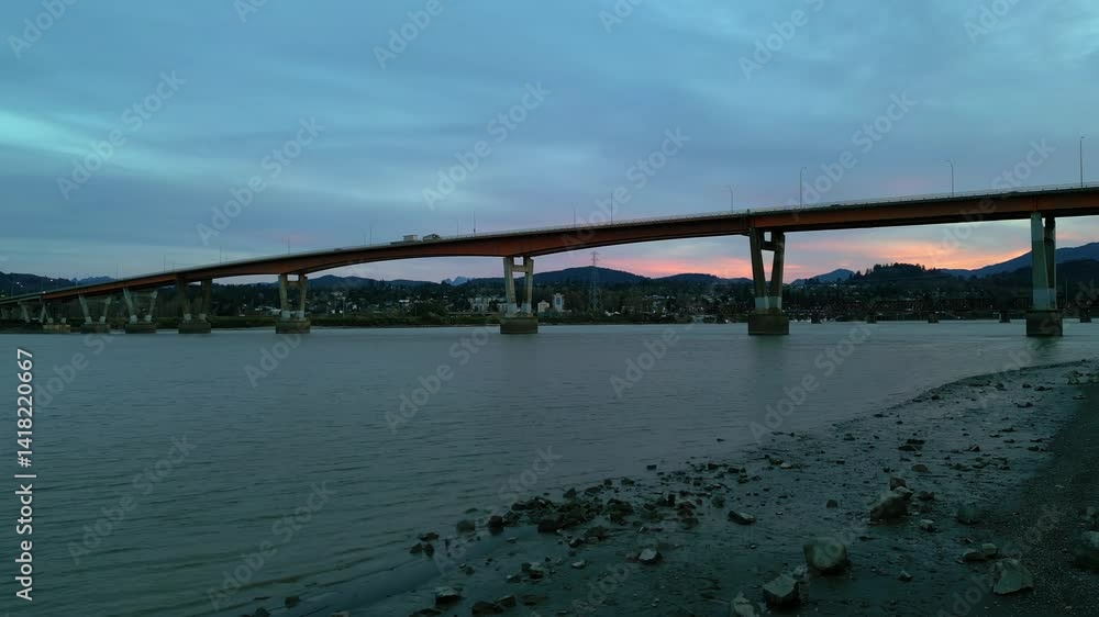 Mission Bridge at Sunset Over the Fraser River With Colorful Sky and Mountains in BC, Canada Mission Bridge at Sunset Over the Fraser River With Colorful Sky and Mountains in BC, Canada