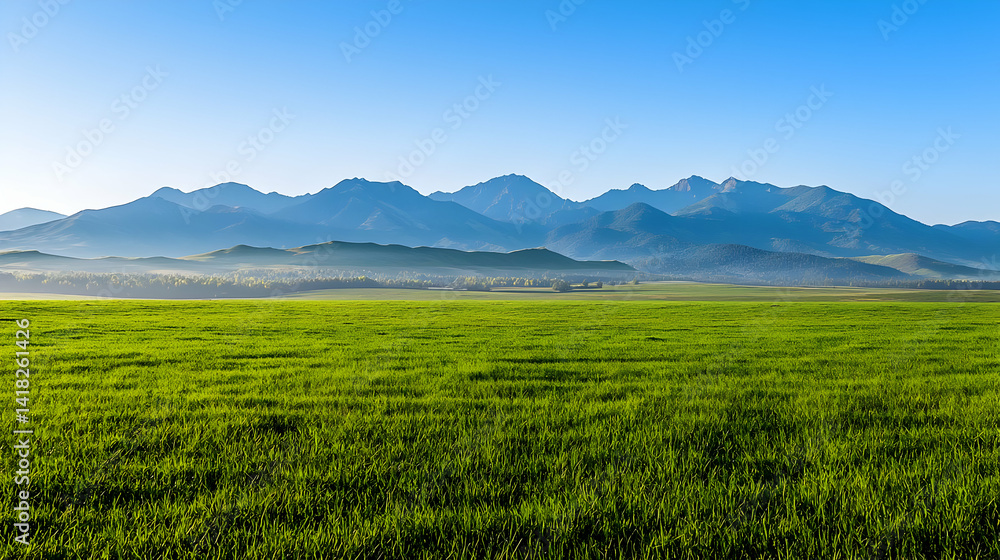 Obraz premium Green Field With Mountains Under Clear Blue Sky