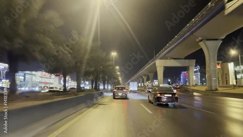 Busy Night Traffic in Hong Kong City with Timelapse Light Trails on Urban Road and Highway Cars Speeding Through the Evening Cityscape