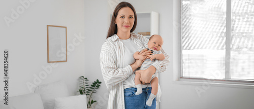 Happy mother holding her cu...